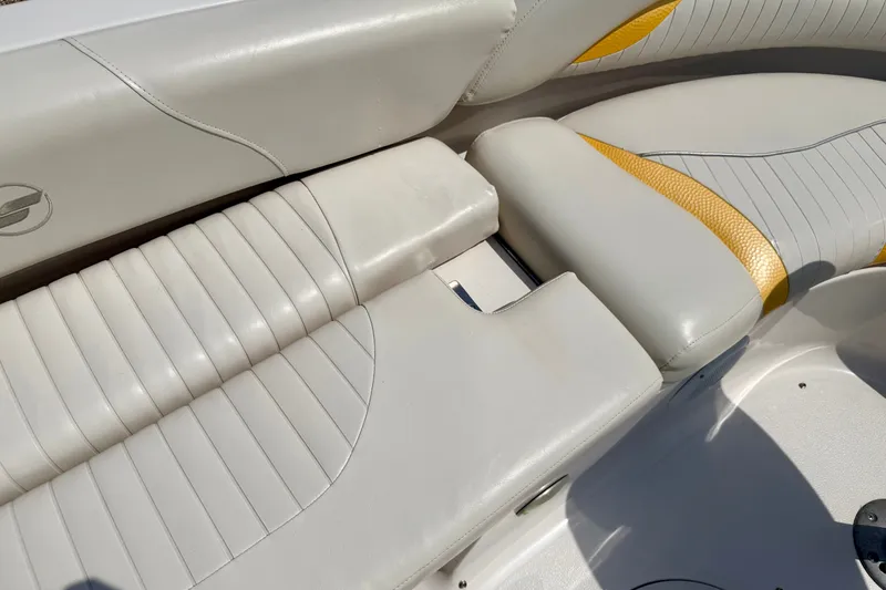 Slide: The Image of 2008 Starcraft Aurora Star Step 190 IO boat interior with white and yellow seating. - 41