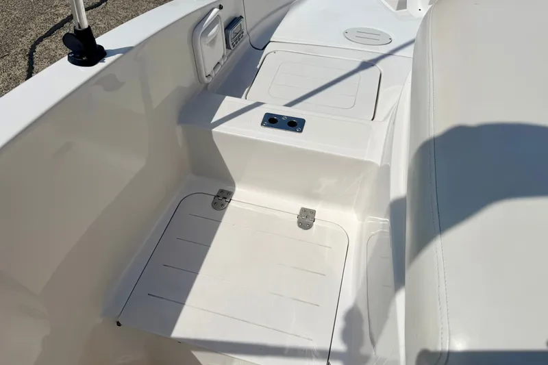 Slide: The Image of 2008 Starcraft Aurora Star Step 190 IO boat interior with seating and storage compartments. - 27