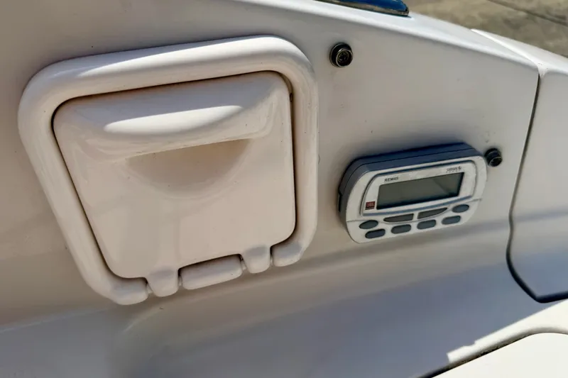 Slide: The Image of 2008 Starcraft Aurora Star Step 190 IO boat dashboard with control panel and storage compartment. - 30