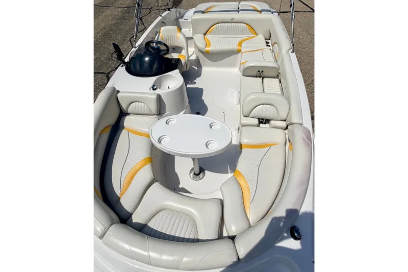 Slide: The Image of 2008 Starcraft Aurora Star Step 190 IO boat interior with white and yellow seating. - 74