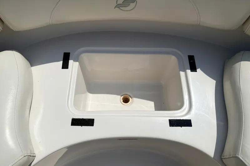 Slide: The Image of 2008 Starcraft Aurora Star Step 190 IO boat interior with built-in storage compartment. - 49