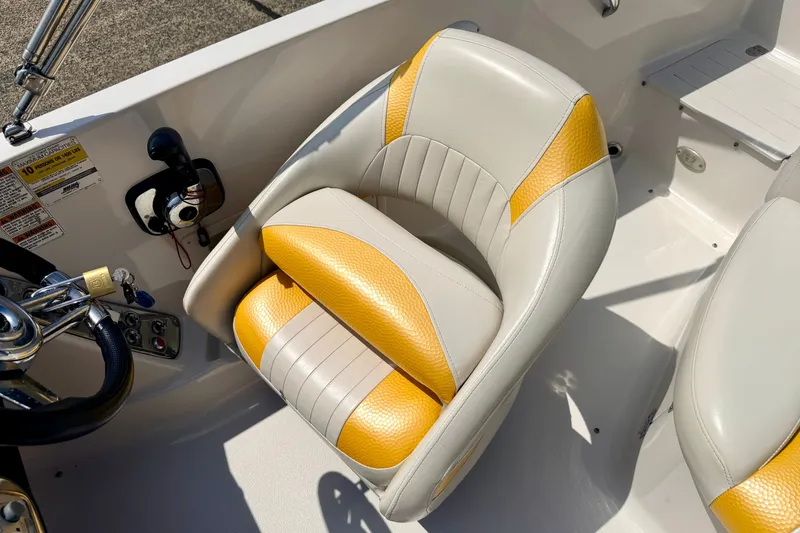 Slide: The Image of 2008 Starcraft Aurora Star Step 190 IO boat seat with yellow and white upholstery. - 53