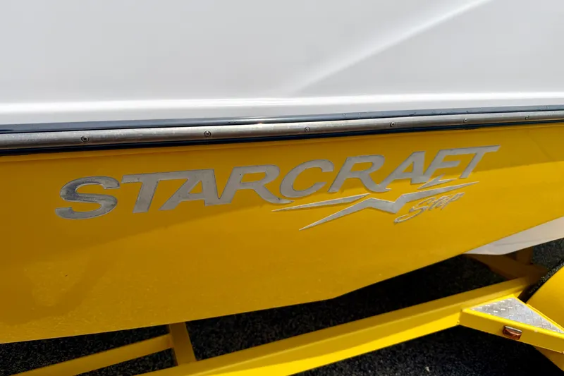 Slide: The Image of Yellow 2008 Starcraft Aurora Star Step 190 IO boat with logo detail. - 6