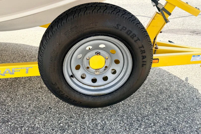 Slide: The Image of Trailer tire of 2008 Starcraft Aurora Star Step 190 IO on yellow frame. - 88