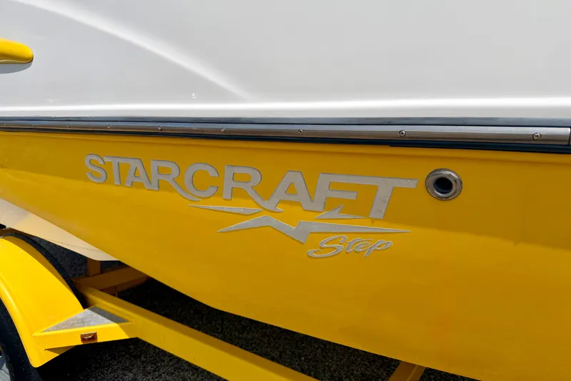 Slide: The Image of Yellow 2008 Starcraft Aurora Star Step 190 IO boat with logo detail. - 14