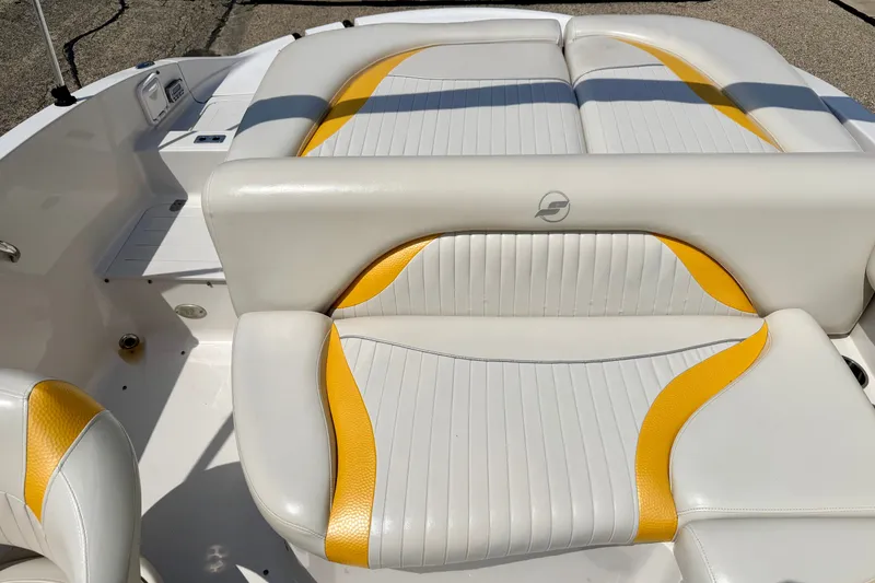 Slide: The Image of 2008 Starcraft Aurora Star Step 190 IO boat interior with white and yellow seating. - 26