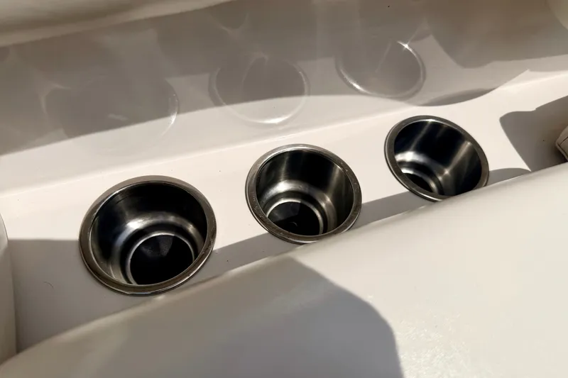Slide: The Image of Cup holders on a 2008 Starcraft Aurora Star Step 190 IO boat interior. - 78