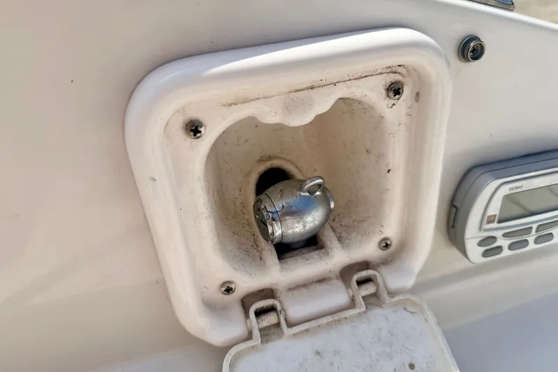 Slide: The Image of 2008 Starcraft Aurora Star Step 190 IO boat detail with metal fitting and control panel. - 31