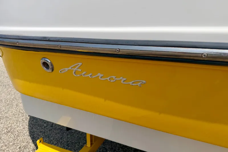 Slide: The Image of 2008 Starcraft Aurora Star Step 190 IO boat with yellow and white exterior. - 19