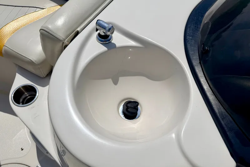 Slide: The Image of 2008 Starcraft Aurora Star Step 190 IO boat sink and seating detail. - 64