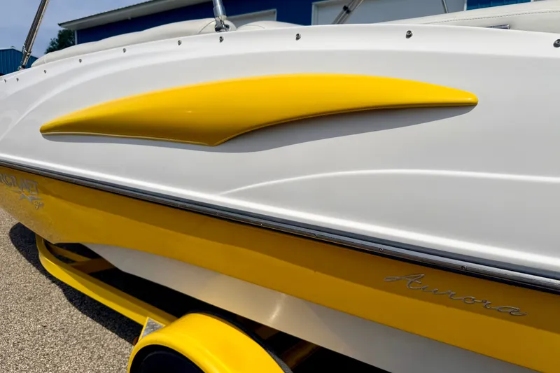 Slide: The Image of 2008 Starcraft Aurora Star Step 190 IO boat, white and yellow exterior detail. - 10