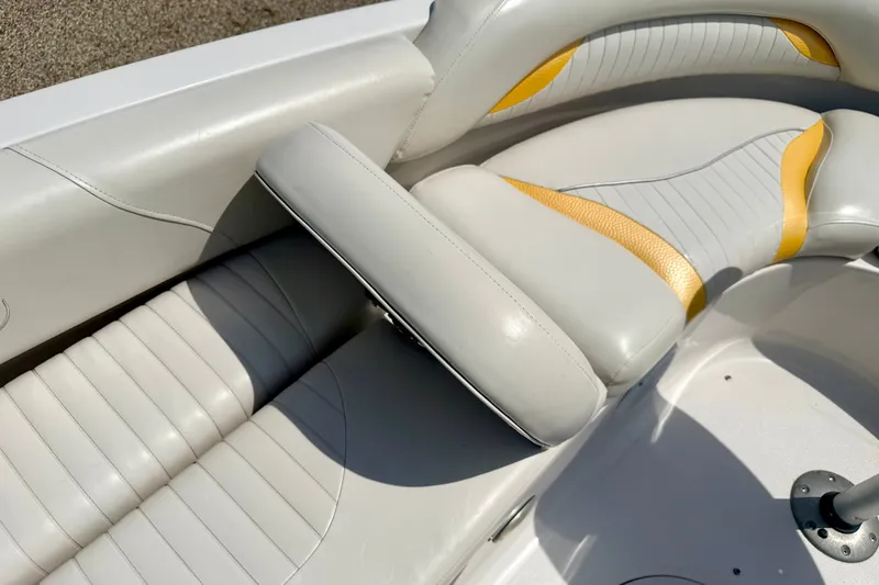 Slide: The Image of 2008 Starcraft Aurora Star Step 190 IO boat interior with white and yellow seating. - 40