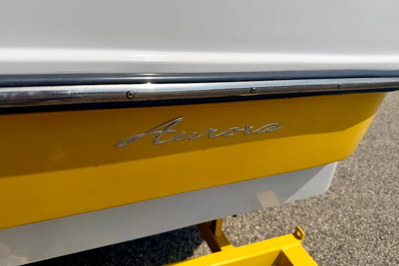 Slide: The Image of 2008 Starcraft Aurora Star Step 190 IO boat with yellow and white exterior detailing. - 9