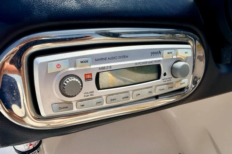 Slide: The Image of Marine audio system in 2008 Starcraft Aurora Star Step 190 IO boat dashboard. - 59