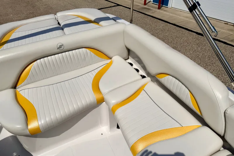 Slide: The Image of 2008 Starcraft Aurora Star Step 190 IO boat interior with white and yellow seating. - 81