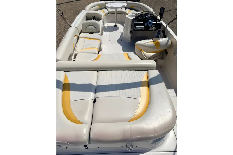 Slide: The Image of 2008 Starcraft Aurora Star Step 190 IO boat interior with white and yellow seating. - 77