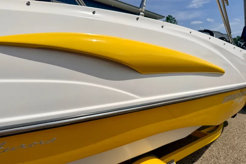Slide: The Image of 2008 Starcraft Aurora Star Step 190 IO boat with yellow and white exterior detailing. - 20