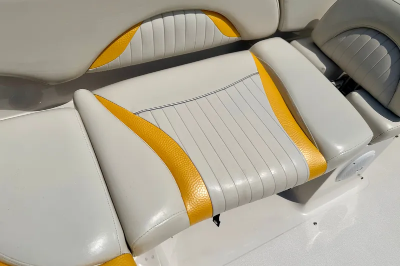 Slide: The Image of 2008 Starcraft Aurora Star Step 190 IO boat seat with yellow and white upholstery. - 36