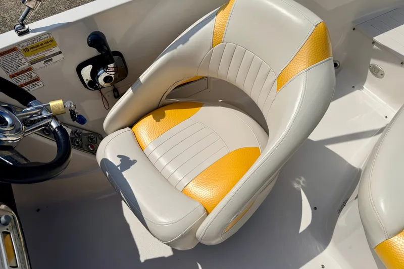 Slide: The Image of 2008 Starcraft Aurora Star Step 190 IO boat seat with yellow and white upholstery. - 52