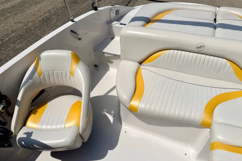 Slide: The Image of 2008 Starcraft Aurora Star Step 190 IO boat interior with white and yellow seating. - 80