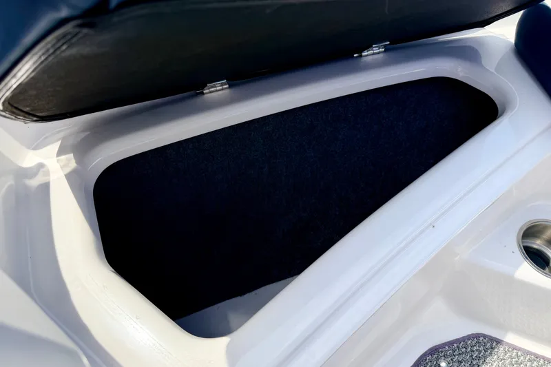 Slide: The Image of Open storage compartment in 2014 Four Winns H200 boat. - 68
