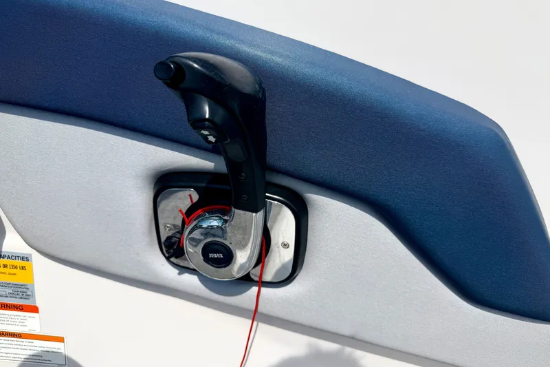 Slide: The Image of Throttle control on a 2014 Four Winns H200 boat, featuring a sleek design. - 59