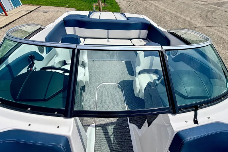 Slide: The Image of 2014 Four Winns H200 boat interior with blue and white seating, viewed from above. - 74