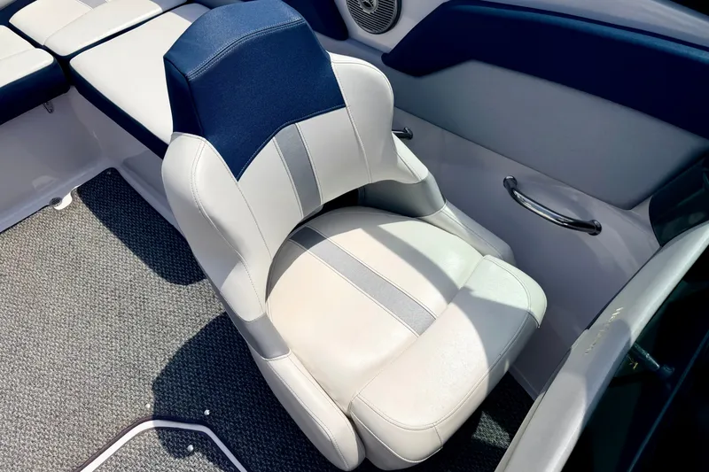 Slide: The Image of 2014 Four Winns H200 boat interior with cushioned seating and carpeted flooring. - 49