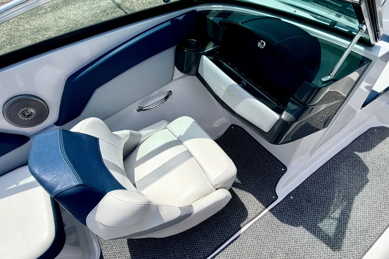 Slide: The Image of Interior of 2014 Four Winns H200 boat with blue and white seating and dashboard. - 45