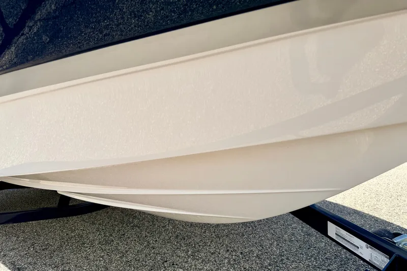 Slide: The Image of 2014 Four Winns H200 boat hull on trailer, showcasing sleek design and craftsmanship. - 84