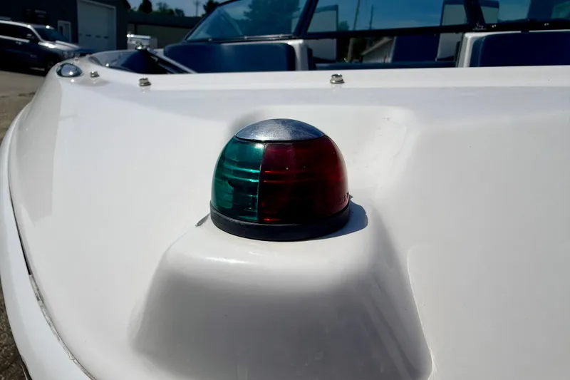 Slide: The Image of 2014 Four Winns H200 boat with navigation light on the bow. - 91