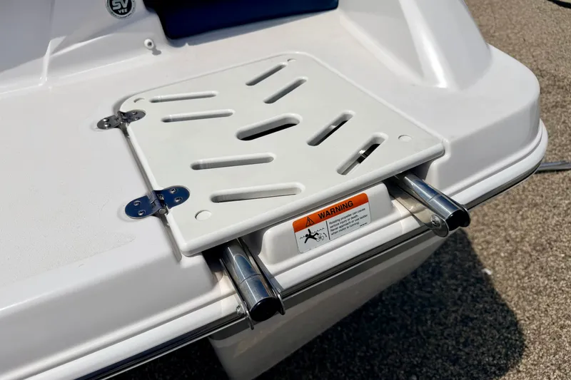 Slide: The Image of 2014 Four Winns H200 boat swim platform with foldable ladder and safety warning label. - 26