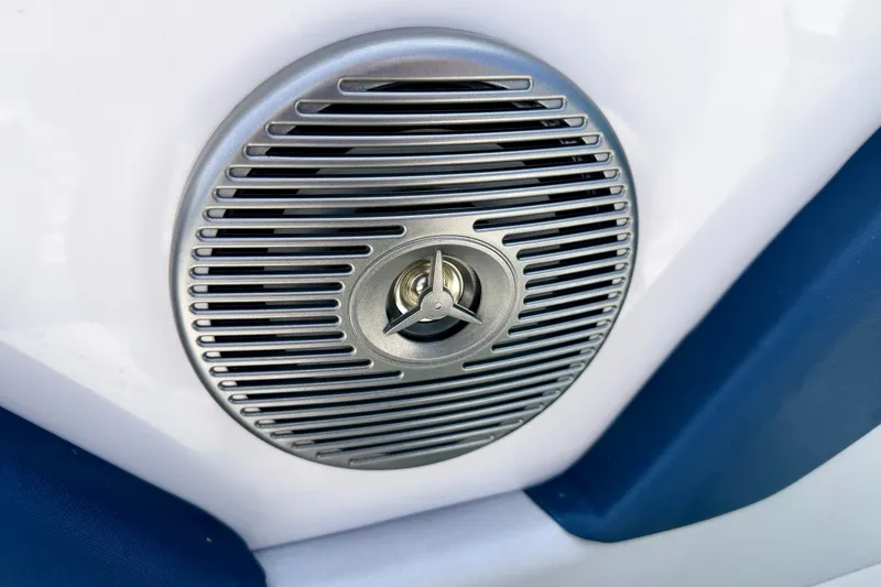 Slide: The Image of Speaker grille on a 2014 Four Winns H200 boat interior. - 63