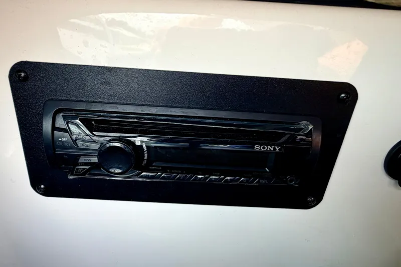 Slide: The Image of Sony stereo system in a 2014 Four Winns H200 boat dashboard. - 48