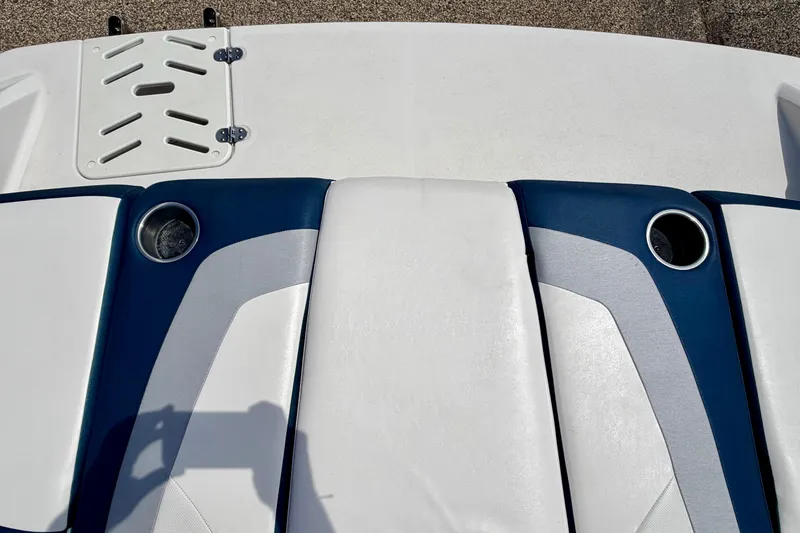 Slide: The Image of Rear seating area of a 2014 Four Winns H200 boat with cup holders. - 30