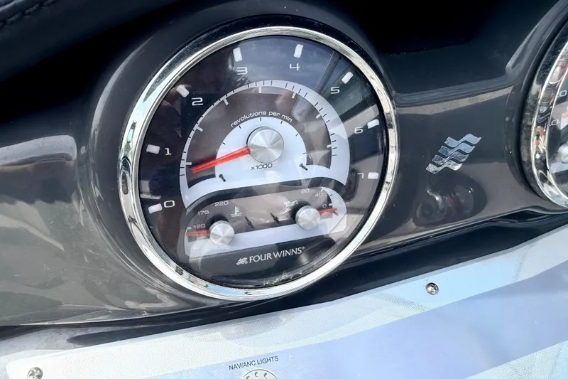 Slide: The Image of Close-up of 2014 Four Winns H200 boat tachometer and speedometer gauges. - 53