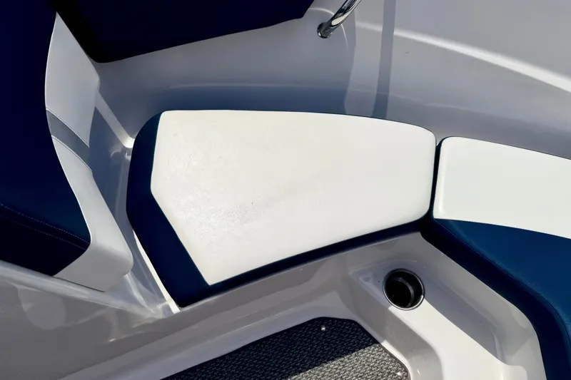 Slide: The Image of 2014 Four Winns H200 boat interior seating with blue and white upholstery. - 67