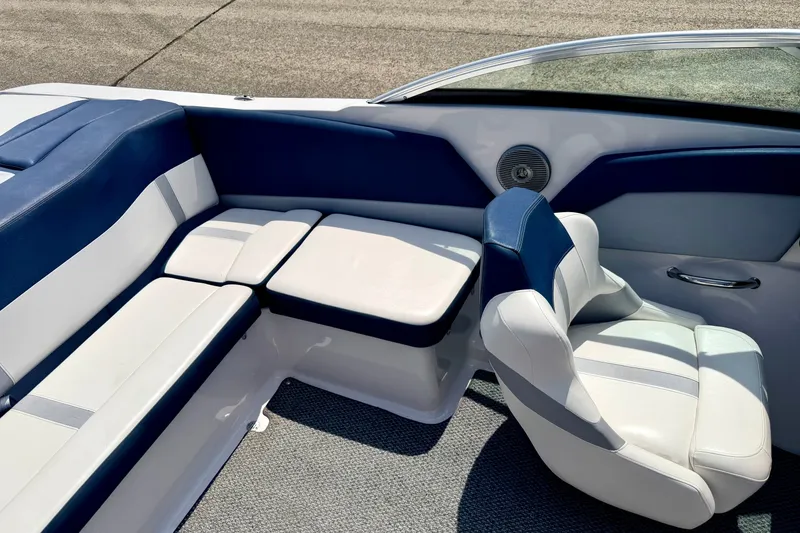 Slide: The Image of Interior of 2014 Four Winns H200 boat with blue and white seating. - 76