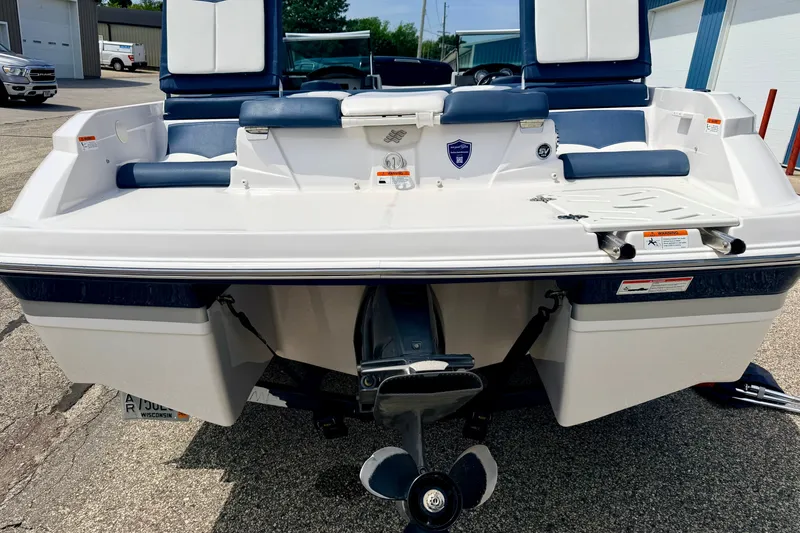 Slide: The Image of 2014 Four Winns H200 boat rear view with outboard motor and seating. - 18