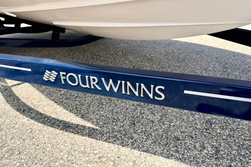 Slide: The Image of Blue trailer with "Four Winns" logo for 2014 H200 boat model. - 83