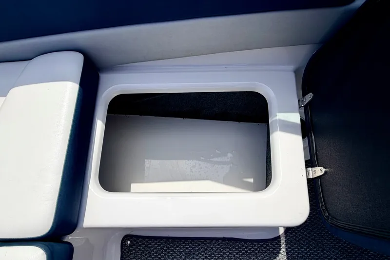 Slide: The Image of Storage compartment in 2014 Four Winns H200 boat, open with visible interior. - 44
