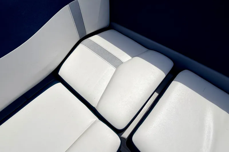 Slide: The Image of White cushioned seats on a 2014 Four Winns H200 boat. - 41