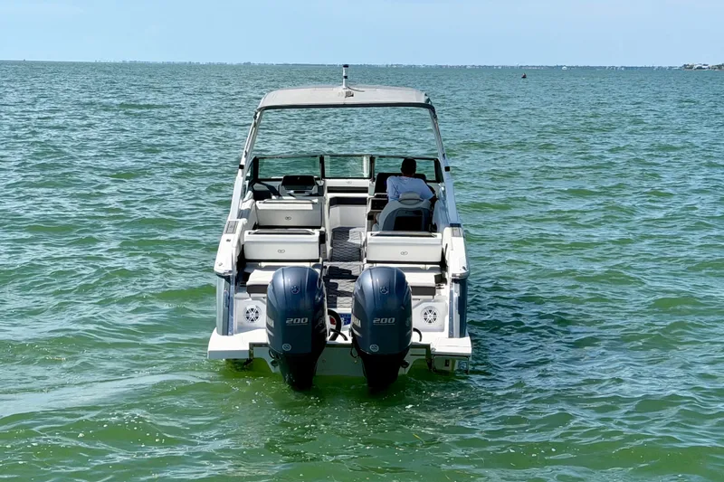 Slide: The Image of 2022 Cobalt R8 Outboard boat on open water, featuring dual engines. - 8