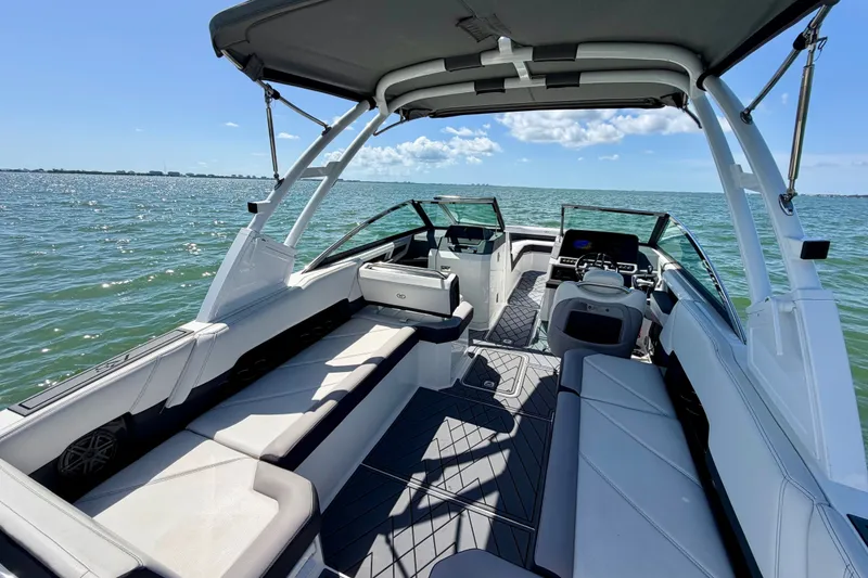 Slide: The Image of 2022 Cobalt R8 Outboard boat interior with spacious seating on open water. - 16