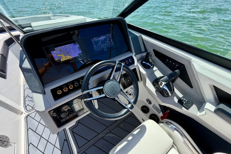 Slide: The Image of 2022 Cobalt R8 Outboard boat cockpit with modern navigation and control systems. - 28