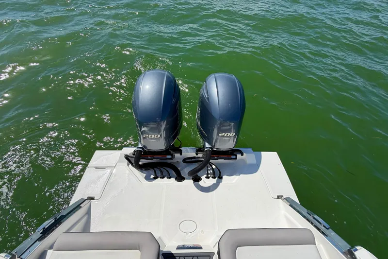 Slide: The Image of 2022 Cobalt R8 Outboard boat with twin 200 horsepower engines on green water. - 21