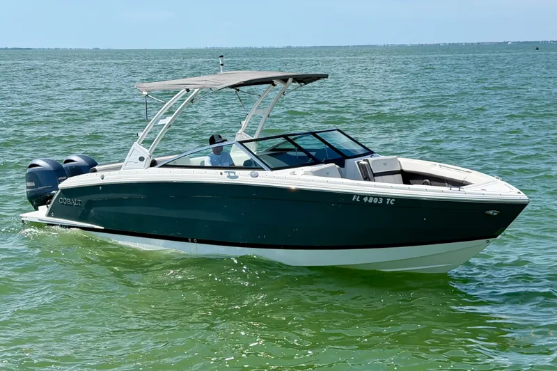 Slide: The Image of 2022 Cobalt R8 Outboard boat cruising on clear blue water. - 4