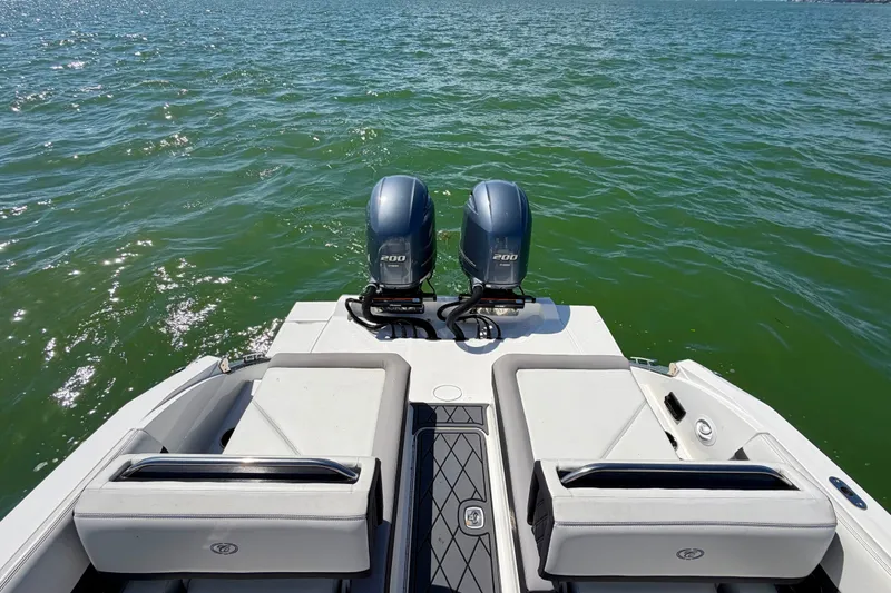 Slide: The Image of 2022 Cobalt R8 Outboard boat with dual engines on open water. - 20