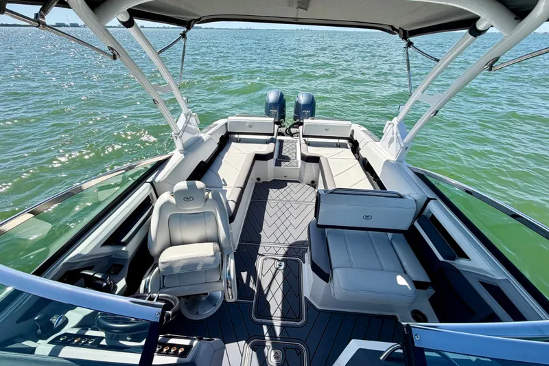 Slide: The Image of 2022 Cobalt R8 Outboard boat interior with spacious seating on open water. - 12