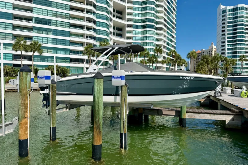 Slide: The Image of 2022 Cobalt R8 Outboard boat docked near modern waterfront buildings. - 39